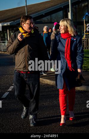 Ecologist Emma Smart (right) with her husband outside HMP Bronzefield, in Surrey, following her release from the prison where she undertook a 26-day hunger strike during her incarceration. Ms Smart was sentenced in November, along with other members of Insulate Britain, to serve four months for breaking a High Court injunction by taking part in a blockade at junction 25 of the M25 motorway during the morning rush hour on October 8, 2021. Picture date: Friday January 14, 2022. Stock Photo