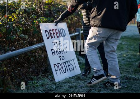 Supporters wait outside HMP Bronzefield, in Surrey, for the release of Ecologist Emma Smart where she undertook a 26-day hunger strike during her incarceration. Ms Smart was sentenced in November, along with other members of Insulate Britain, to serve four months for breaking a High Court injunction by taking part in a blockade at junction 25 of the M25 motorway during the morning rush hour on October 8, 2021. Picture date: Friday January 14, 2022. Stock Photo