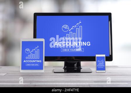 Accounting concept shown on different information technology devices Stock Photo