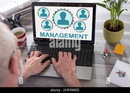 Management concept shown on a laptop used by a man Stock Photo
