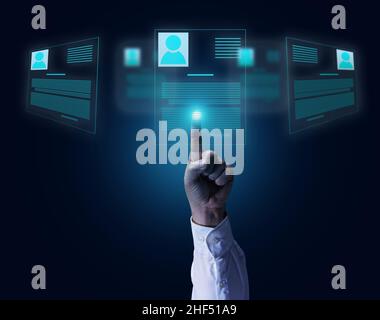 male hand selects resume on holographic screen. Recruitment concept, search for talented employees, team building Stock Photo