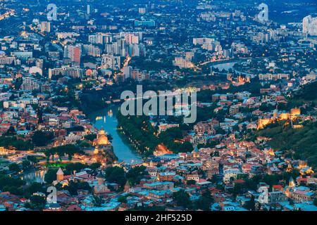 Tbilisi Georgia. Aerial Cityscape, Famous Illuminated Landmarks: Metekhi Church, Narikala Fortress Stock Photo