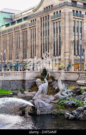 The Triton Fountain in the city centre of Düsseldorf, created by the sculptor Friedrich Coubillier from 1898 to 1902. Triton is a Greek Sea God. Stock Photo