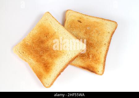 Two slices of hot toasted bread isolated on white, top view Stock Photo