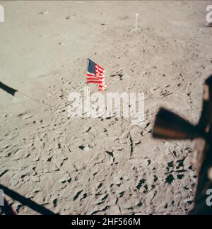 The flag of the United States and the footprints of astronauts Neil A. Armstrong and Edwin E. Aldrin Jr., deployed on the surface of the moon. Apollo. Stock Photo