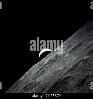 Crescent Earth rises above the lunar horizon taken during the Apollo 17 mission. (NASA). Stock Photo