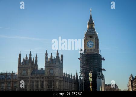 12 January 2022, London - Scaffolding is removed from the top part of the Elizabeth tower to reveal all clock faces Stock Photo