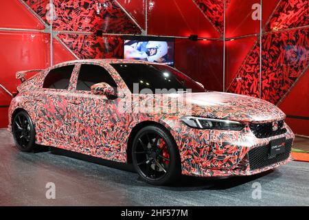 Chiba, Japan. 14th Jan, 2022. Japan's automobile giant Honda Motor displays a camouflage designed high performance vehicle 'CIVIC Type-R' which will go on sale this year at the Tokyo Auto Salon in Chiba, suburban Tokyo on Friday, January 14, 2022. An annual custom car show started a three-day live event for the first time in two years. Credit: Yoshio Tsunoda/AFLO/Alamy Live News Stock Photo