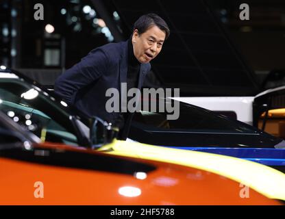 Chiba, Japan. 14th Jan, 2022. Japan's automobile giant Nissan Motor president Makoto Uchida smiles as he unveils the prototype sports car 'Fairlady Z Customized Proto' at the Tokyo Auto Salon in Chiba, suburban Tokyo on Friday, January 14, 2022. An annual custom car show started a three-day live event for the first time in two years. Credit: Yoshio Tsunoda/AFLO/Alamy Live News Stock Photo