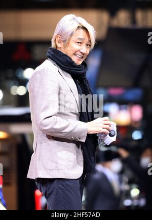 Chiba, Japan. 14th Jan, 2022. Japan's motor racing team Kondo Racing owner Masahiko Kondo smiles as he unveil Nissan Motor's prototype sports car 'Fairlady Z Customized Proto' at the Tokyo Auto Salon in Chiba, suburban Tokyo on Friday, January 14, 2022. An annual custom car show started a three-day live event for the first time in two years. Credit: Yoshio Tsunoda/AFLO/Alamy Live News Stock Photo