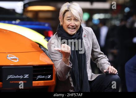 Chiba, Japan. 14th Jan, 2022. Japan's motor racing team Kondo Racing owner Masahiko Kondo smiles as he unveil Nissan Motor's prototype sports car 'Fairlady Z Customized Proto' at the Tokyo Auto Salon in Chiba, suburban Tokyo on Friday, January 14, 2022. An annual custom car show started a three-day live event for the first time in two years. Credit: Yoshio Tsunoda/AFLO/Alamy Live News Stock Photo