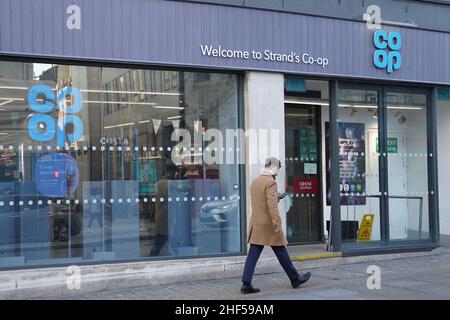 A view of the Co-Op store on The Strand, central London, which was allegedly visited by a person with a suitcase to purchase wine for a party being held in Downing Street the day before the Duke of Edinburgh's funeral in April 2021. Downing Street has apologised to Buckingham Palace after it was reported that two parties were held in Number 10 the day before the Duke's funeral, with the Prime Minister's former director of communications James Slack apologising for the 'anger and hurt' one of the events - a leaving do held for him - had caused. Picture date: Friday January 14, 2022. Stock Photo