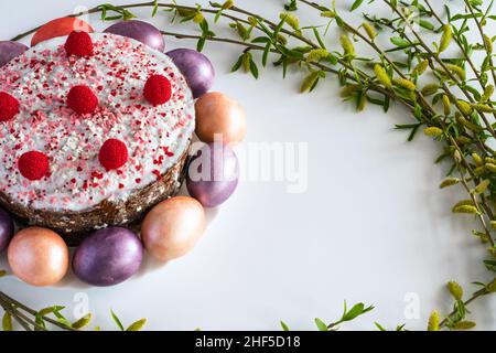Easter cake and painted Easter eggs with willow branches. Horizontal photo. Stock Photo