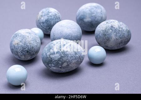 Close-up of Easter eggs of marble coloring on a gray background. Easter background. Horizontal photo. Stock Photo