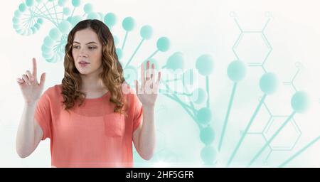 Composite image of caucasian woman touching invisible screen against dna structure and copy space Stock Photo