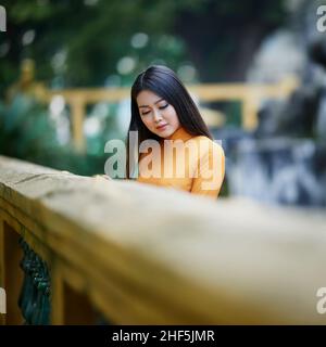 Ho Chi Minh city, Viet Nam: Vietnamese girl going to pagoda in ao dai Stock Photo