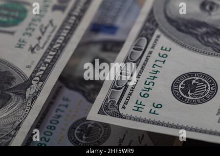 Benjamin Franklin peeking through 100 dollar banknotes for design purpose Stock Photo