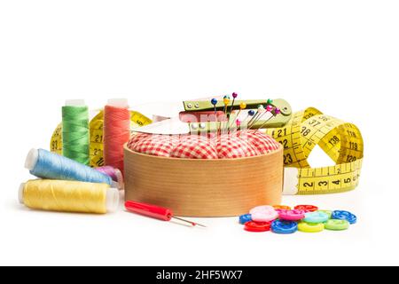 Scissors, sewing thread, buttons and sewing accessories on a white background Stock Photo