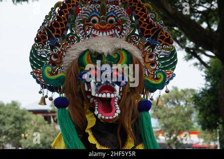 The artist performing Jaranan music dancers and playing a traditional instrument. Jaranan (kuda lumping, kuda kepang) is dance from java Stock Photo