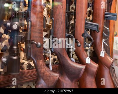 Annecy, France - January 7, 2022: Rifles in the display case of a firearms store in Annecy Stock Photo