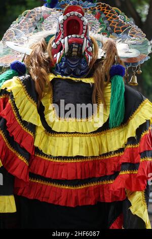 The artist performing Jaranan music dancers and playing a traditional instrument. Jaranan (kuda lumping, kuda kepang) is dance from java Stock Photo