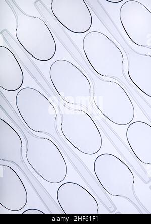 Tessellated pattern of plastic disposable spoons Stock Photo