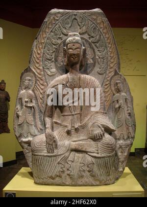 Seated Buddha with Attending Bodhisattva, China, Northern Wei Dynasty, early 6th century AD, limestone Stock Photo