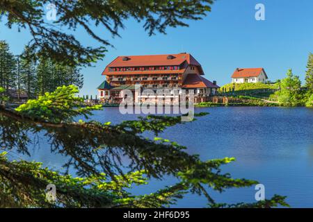 View over the Mummelsee to the Berghotel Mummelsee,  Black Forest National Park,  Baden-Wuerttemberg,  Germany Stock Photo