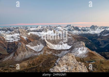 Wild mountain landscape with snow-capped mountains after sunset between Warth and Lech. Lechtal Alps dominated by the Verwall. Tyrol,  Vorarlberg,  Austria,  Europe Stock Photo