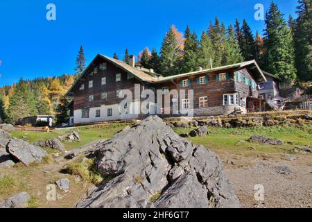 Gasthaus Obernberger See,  Austria,  Tyrol,  Wipptal,  Obernberg am Brenner,  rock in the foreground Stock Photo