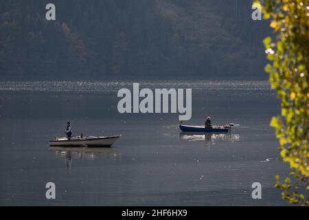 Two fishermen in their boats on Lake Millstatt,  Carinthia,  Austria,  Europe Stock Photo