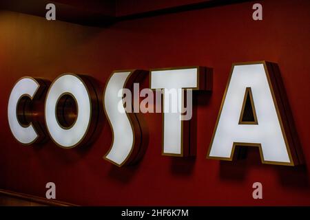 Durham, UK - 23rd August 2019: Costa Coffee illuminated advertising inside a coffeehouse. The brand was founded in London in 1971 by the Costa family. Stock Photo