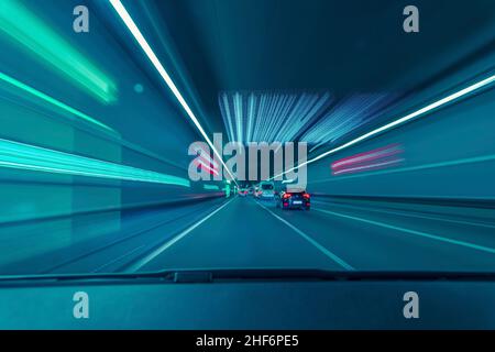 Highspeed drive through a underground tunnel from the car drivers view Stock Photo