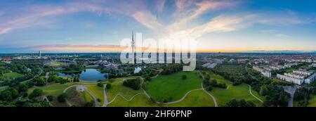Idyllic view over Munich with some its popular landmarks at the Olympic Park with wonderful green parts combined with modern architecture Stock Photo