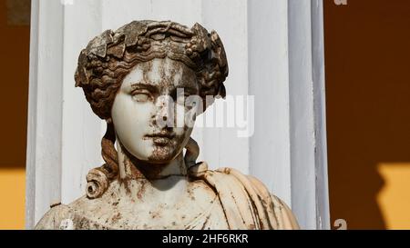 Greece,  Greek Islands,  Ionian Islands,  Corfu,  Achilleion,  residence of Empress Sissis,  built in 1889,  architecture based on Greek mythology,  terraces,  marble head of one of the nine muses,  in front of a Greek-looking column Stock Photo