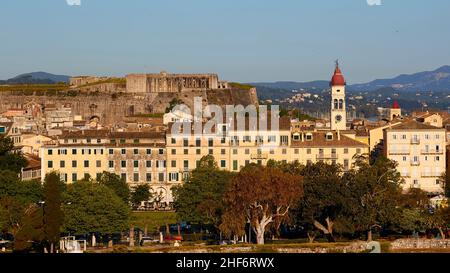 Greece,  Greek Islands,  Ionian Islands,  Corfu,  Corfu Town,  old town,  old fortress,  view from there onto part of the old town with Agios Spiridon church,  behind it the New Fortress rises on a hill,  blue sky Stock Photo