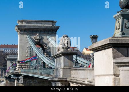 Budapest, Hungary - 12th March 2019: The Széchenyi Chain Bridge is a suspension bridge that spans the River Danube between Buda and Pest, popular with Stock Photo