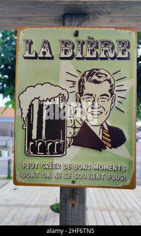 old advertising sign with picture and writing for beer "can create good times that we no longer remember" in Montalivet les Bains,  Cote d'Argent region,  French Atlantic coast Stock Photo