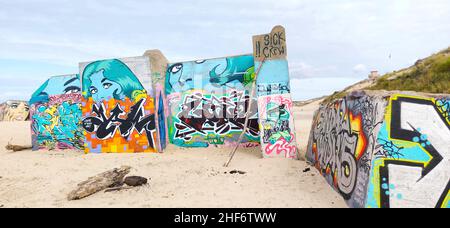 Graffiti on the bunker walls at Plage Le Gurp,  France,  Atlantic coast,  Bordelaise, Stock Photo