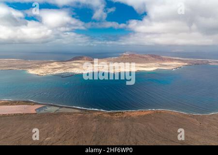 View from the Mirador del Rio to the Salinas del Rio and La Graciosa Island,  Lanzarote,  Canaries,  Canary Islands,  Spain,  Europe Stock Photo