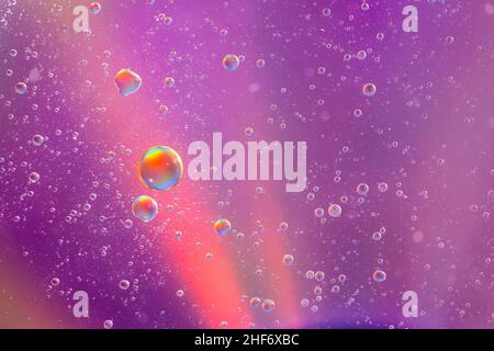 Oil bubbles on water surface,  multicolored background,  abstract image Stock Photo