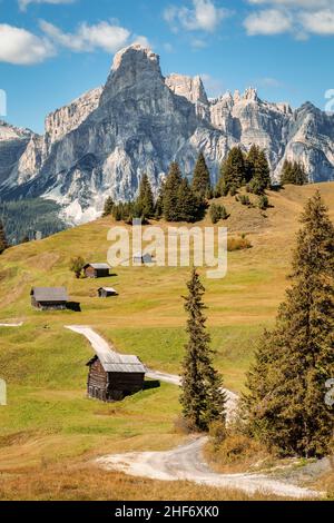 Italy,  South Tyrol,  Bolzano province,  Corvara in Badia,  alpine landscape with wooden huts at the Incisa meadows,  in the peaks of the Puez group,  Dolomites Stock Photo