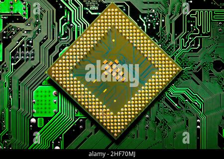 Macro Close up of microchips and pins on Main CPU PC processor circuit board. Stock Photo