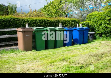 British recycling waste bins - segregation responsibility for plastic recycling, cans, glass and general waste. Clean up after yourselves Stock Photo