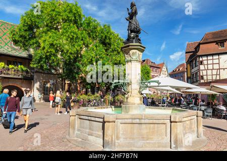 Schwendi fountain on Place de l'Ancienne Douane,  Koifhus at the back,  Colmar,  Alsatian Wine Route,  Alsace,  France Stock Photo