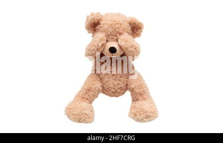 Child abuse concept. Teddy bear cover eye isolated on white background, front view Stock Photo