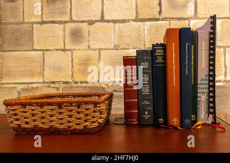 Durham, UK - 29 August 2019: A variety of religious texts such as the Holy Bible inside the Durham Cathedral, England. For use during services, prayer Stock Photo