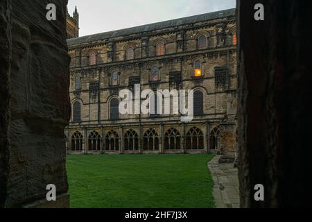 Durham, UK - 29 August 2019: The courtyard inside Durham Cathedral. Glowing, illuminating in the evening, night. Harry potter filmed scenes here. Beau Stock Photo