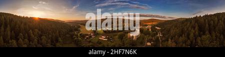 Germany,  Thuringia,  Königsee,  Paulinzella,  monastery ruins,  village,  overview,  mountains,  forest,  sunrise,  partly back light,  360 –° panorama Stock Photo