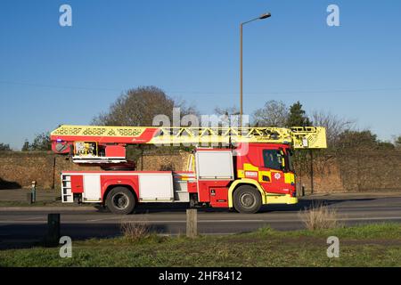 LFB fire engine carries onboard ladder rushing to a house fire in Dorchester road in Bexley London England Stock Photo